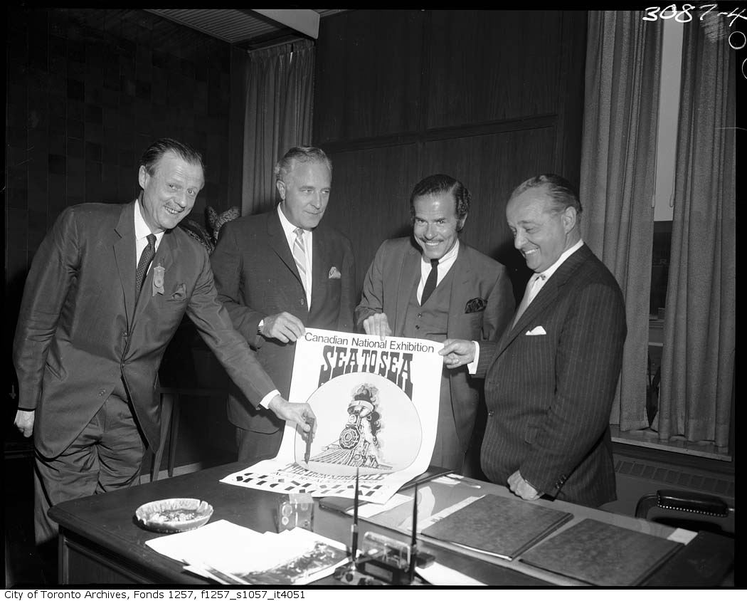 Bert Powell and other CNE officials with Sea to Sea - The Iron Miracle poster 1967
